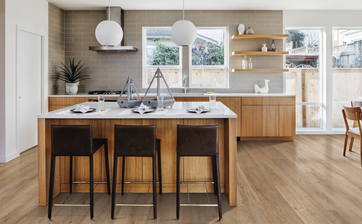 light wood waterproof flooring with midcentury modern wood cabinets and brown stools